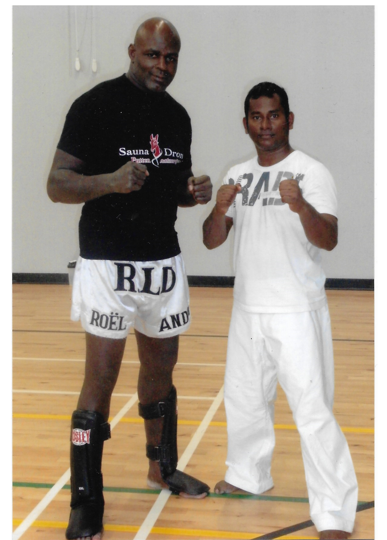  Shihan Prasanna Fernando with Ernesto Hoost  ‘'Mister Perfect’' is a monument in the sport of Kickboxing. A four-time K-1 World Grand Prix champion. 